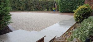 Resin bound driveway with Optimal anthracite porcelain steps.